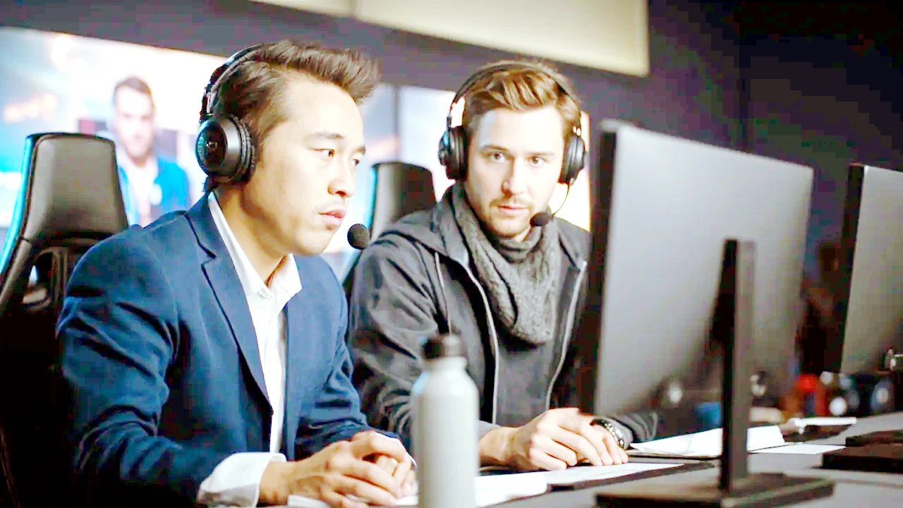 Two esports commentators at the broadcast caster desk